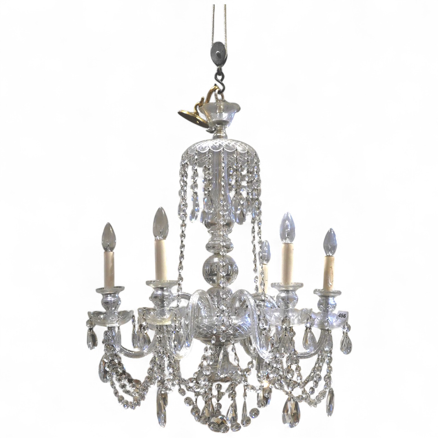 A cut glass five branch chandelier with drops